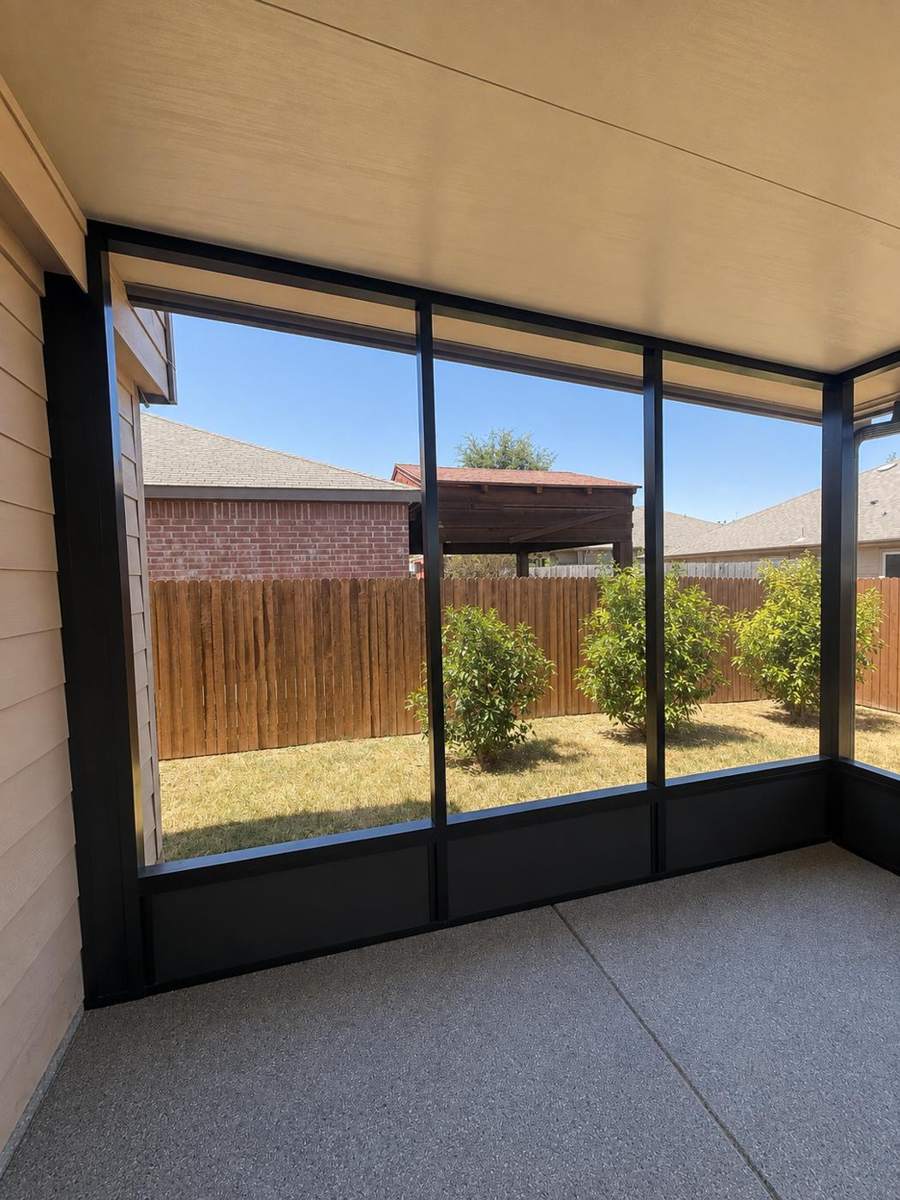 Almanza screen room corner view through full-height screens