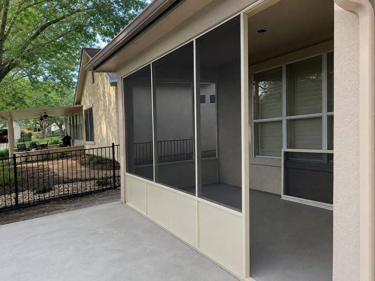 Cream-frame screened porch with white kick panels on the Jacobs project