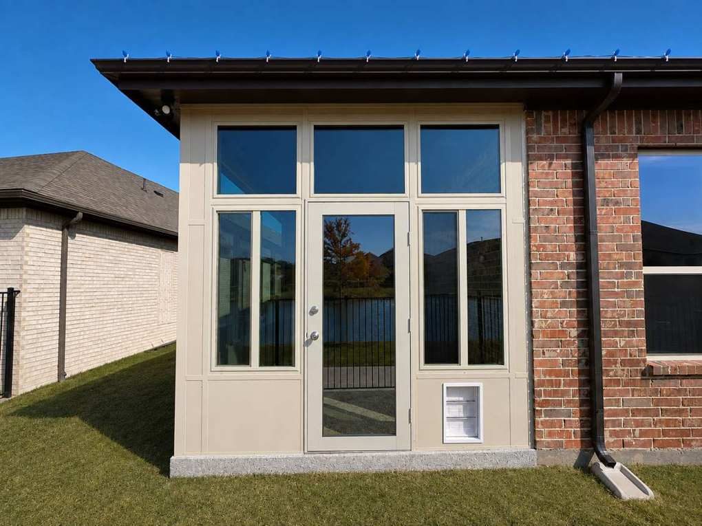 Lakeside glass door elevation with built-in pet door