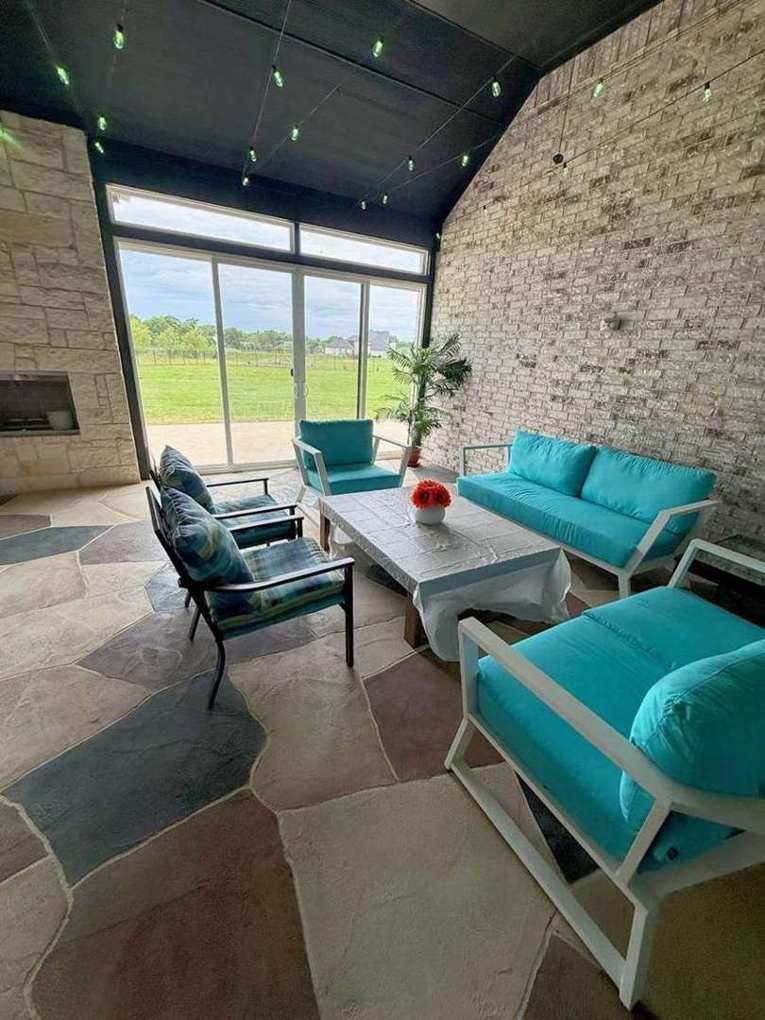 Stacked-stone fireplace wall under a star-lit ceiling