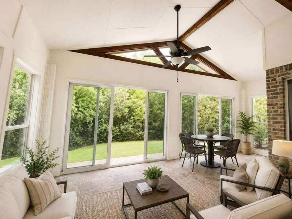 Vaulted Rockwall interior with dining area