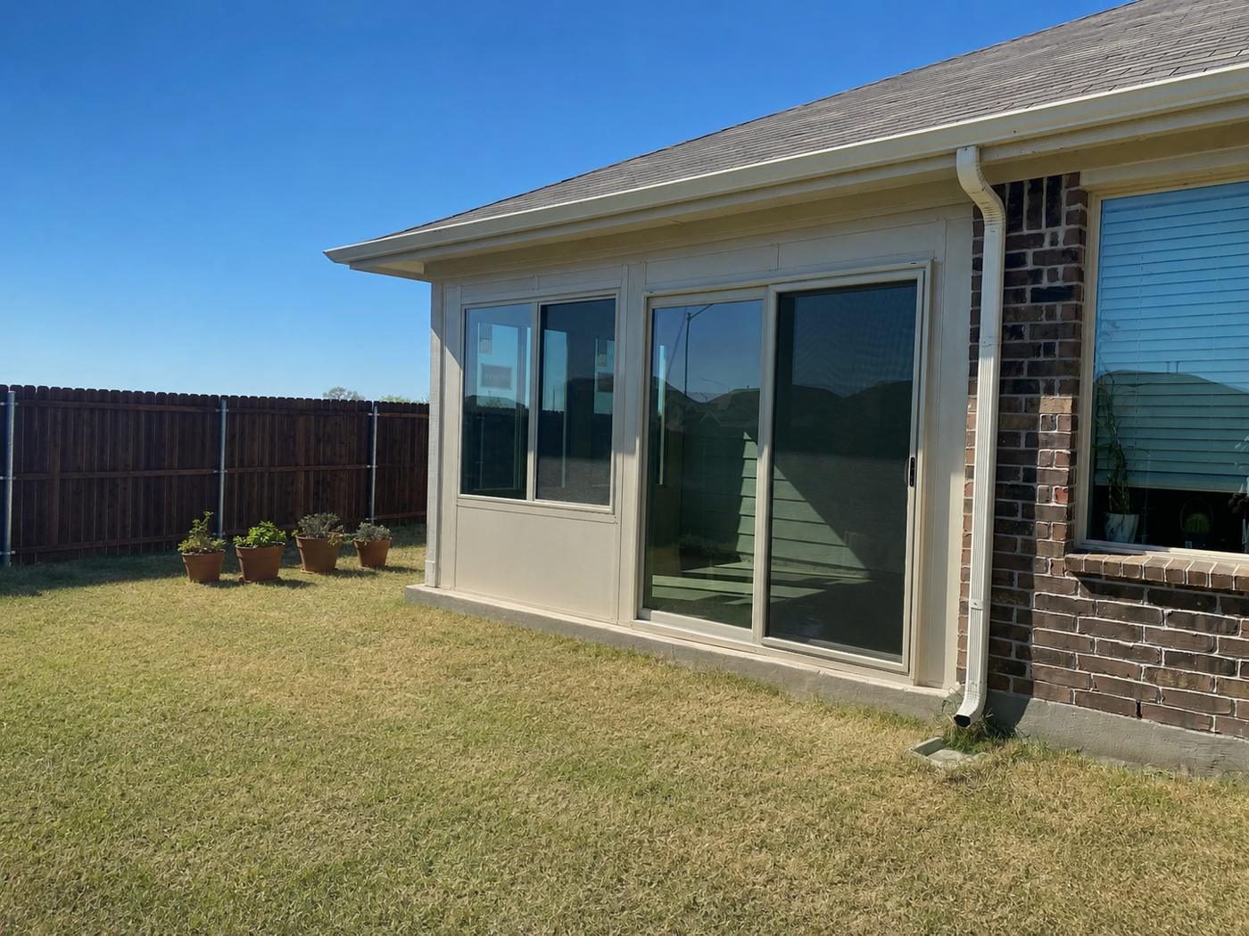 Side elevation of the sunroom with sliding glass doors